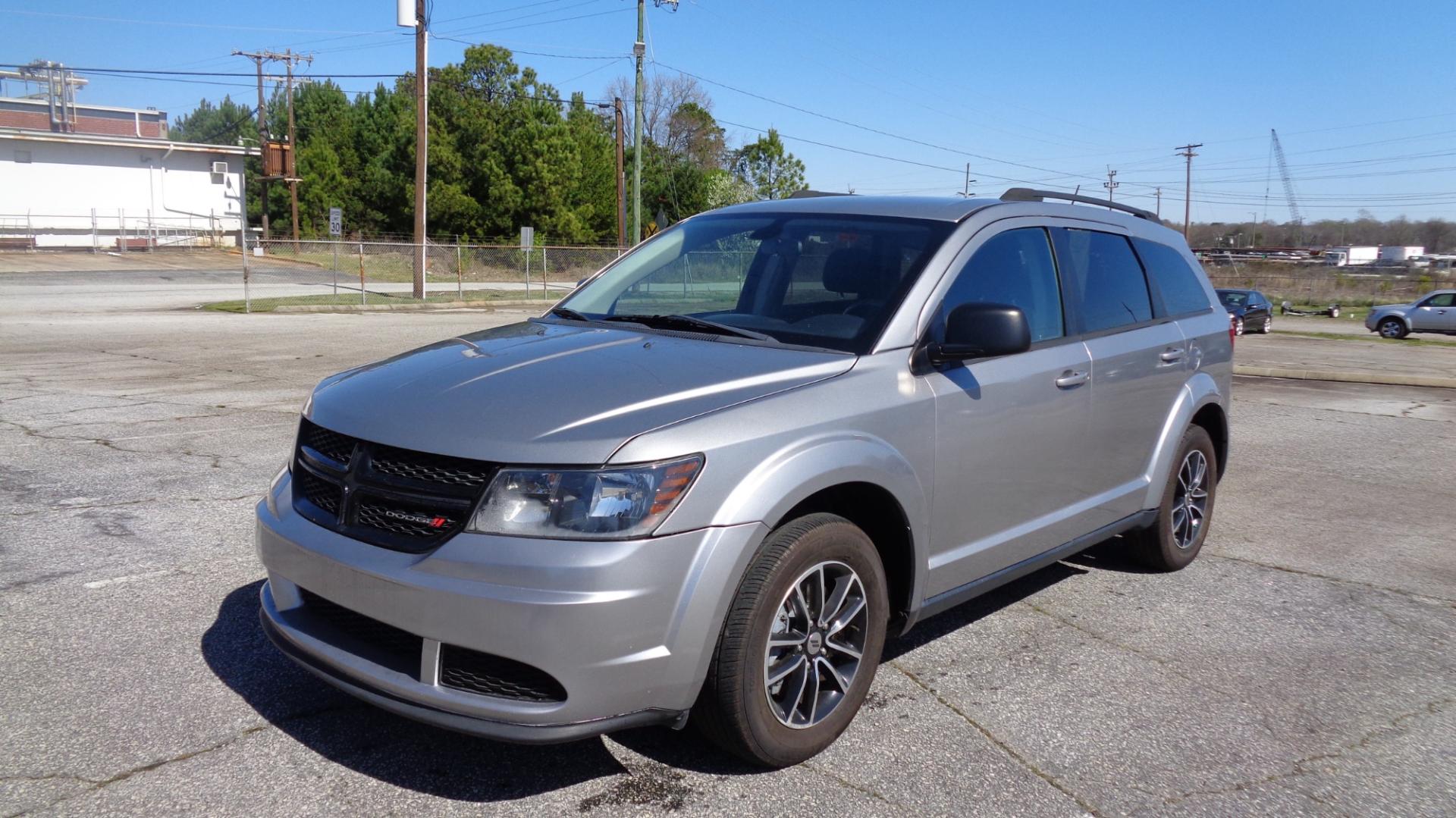 2018 SILVER /Black Dodge Journey SE (3C4PDCAB7JT) with an 2.4L L4 DOHC 16V engine, Automatic transmission, located at 2812 White Horse Road, Greenville, SC, 29611, (864) 269-1711, 34.808655, -82.434776 - 2.4 LITER 4 CYLINDER ENGINE,17 INCH ALLOY WHEELS,ANTI LOCK BRAKES,ANTI THEFT SYSTEM,2 ZONE A/C CLIMATE CONTROL,TILT/REACH STEERING,DUAL AIRBAGS,FRONT/SIDE REAR AIRBAGS,BODY COLOR BUMPERS AND DOOR HANDLES,CRUISE CONTROL,AUTOMATIC HEADLIGHTS,USB/AUX OUTLET,VANITY MIRRORS,TRACTION CONTROL,POWER MIRRORS - Photo#0